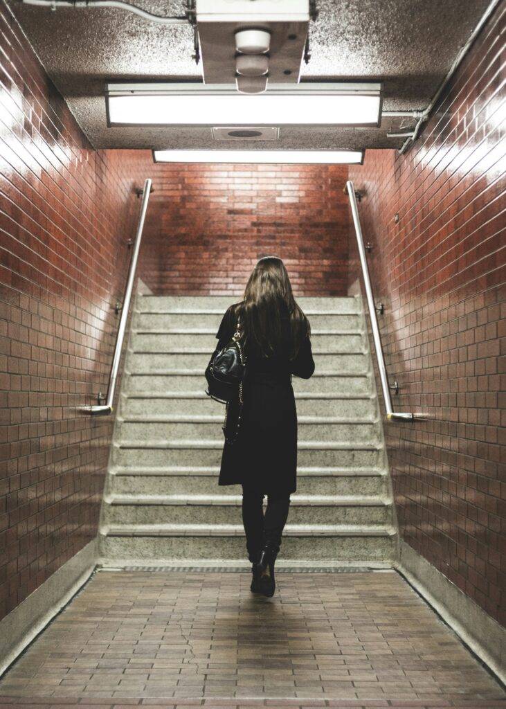 Woman walking up stairs